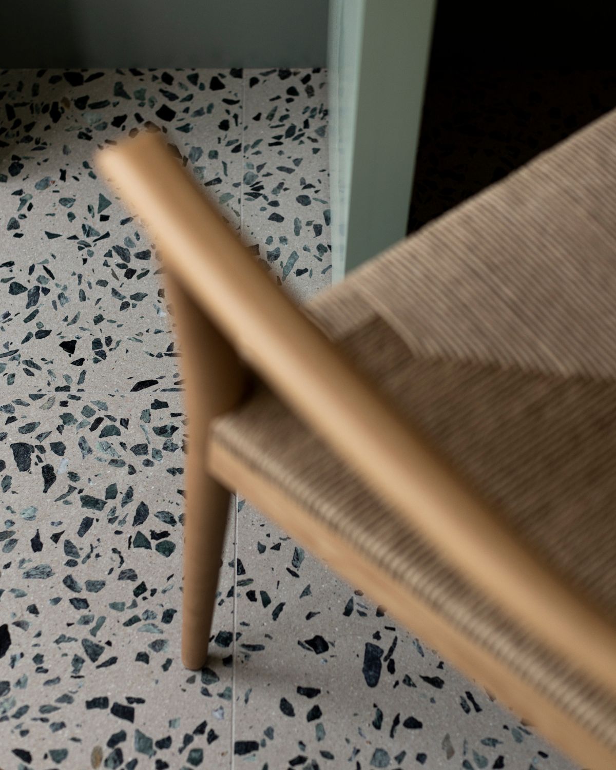 Wooden chair leg on a terrazzo floor