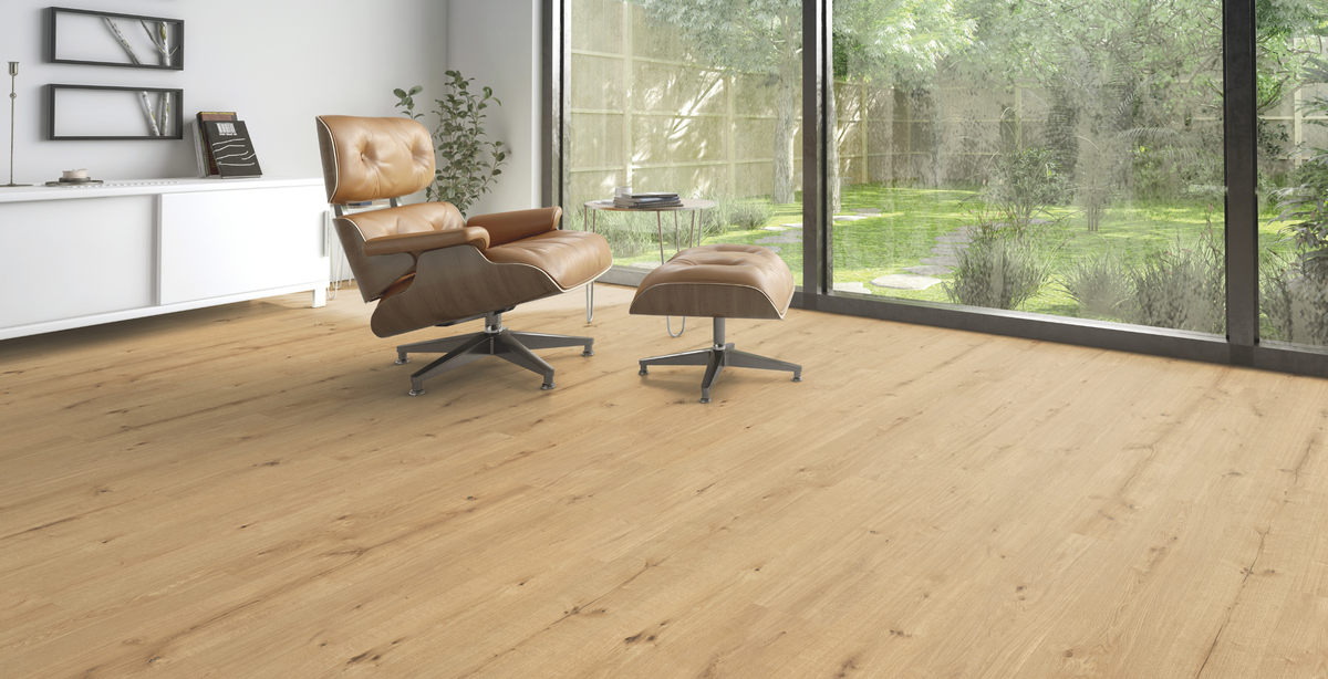 Engineered oak wide plank running unbroken to a full-height window wall